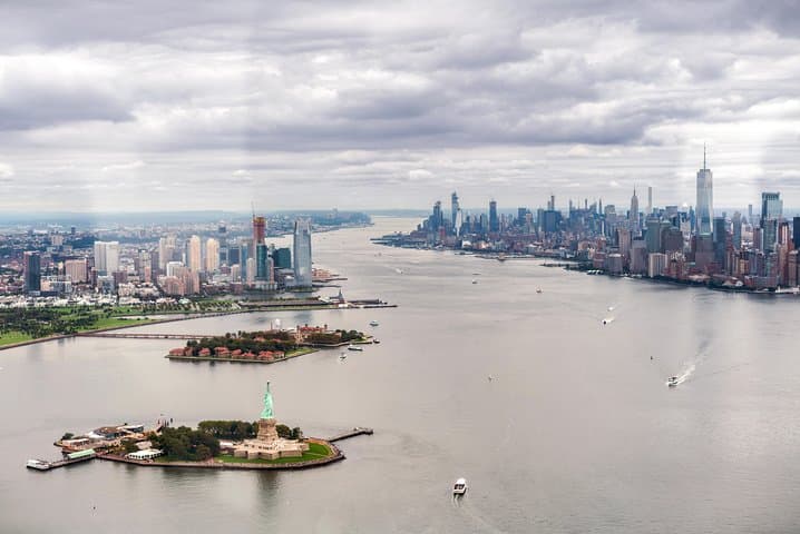 Aerial view of the Statue of Liberty, Jersey City, and Manhattan.