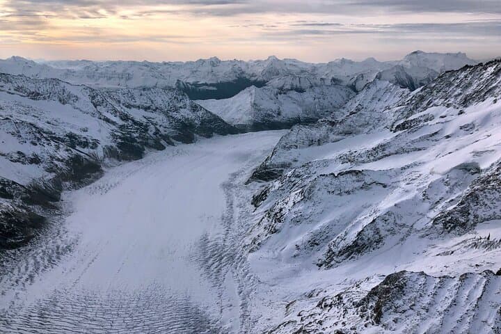 Sunrise over the Swiss Alps with a big glacier below
