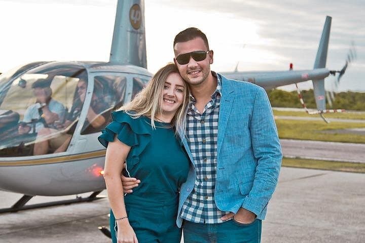 Photo in front of the Helicopter.