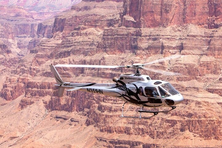 Fly above and below the Rim of the West Rim of the Grand Canyon by helicopter