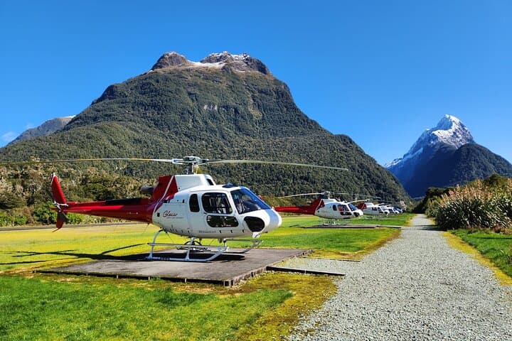 GSLH Helicopters lined up at Milford Sound Airport (Mitre Peak in the background)