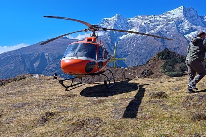 Disembarking from the helicopter at Everest View Point.
